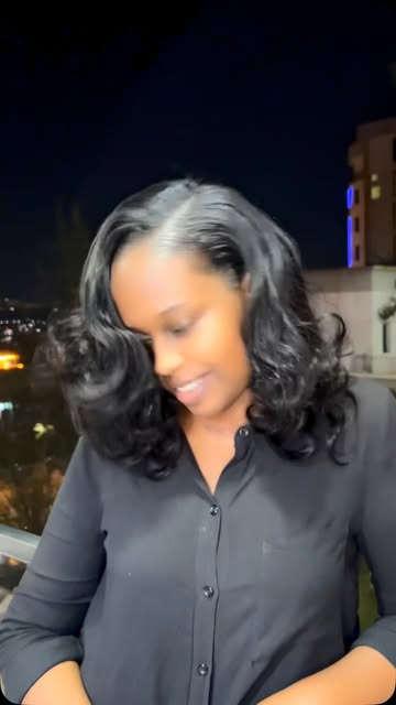 Voluminous dark curls with a smooth top