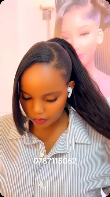 Sleek side part with a face-framing swoop and high ponytail
